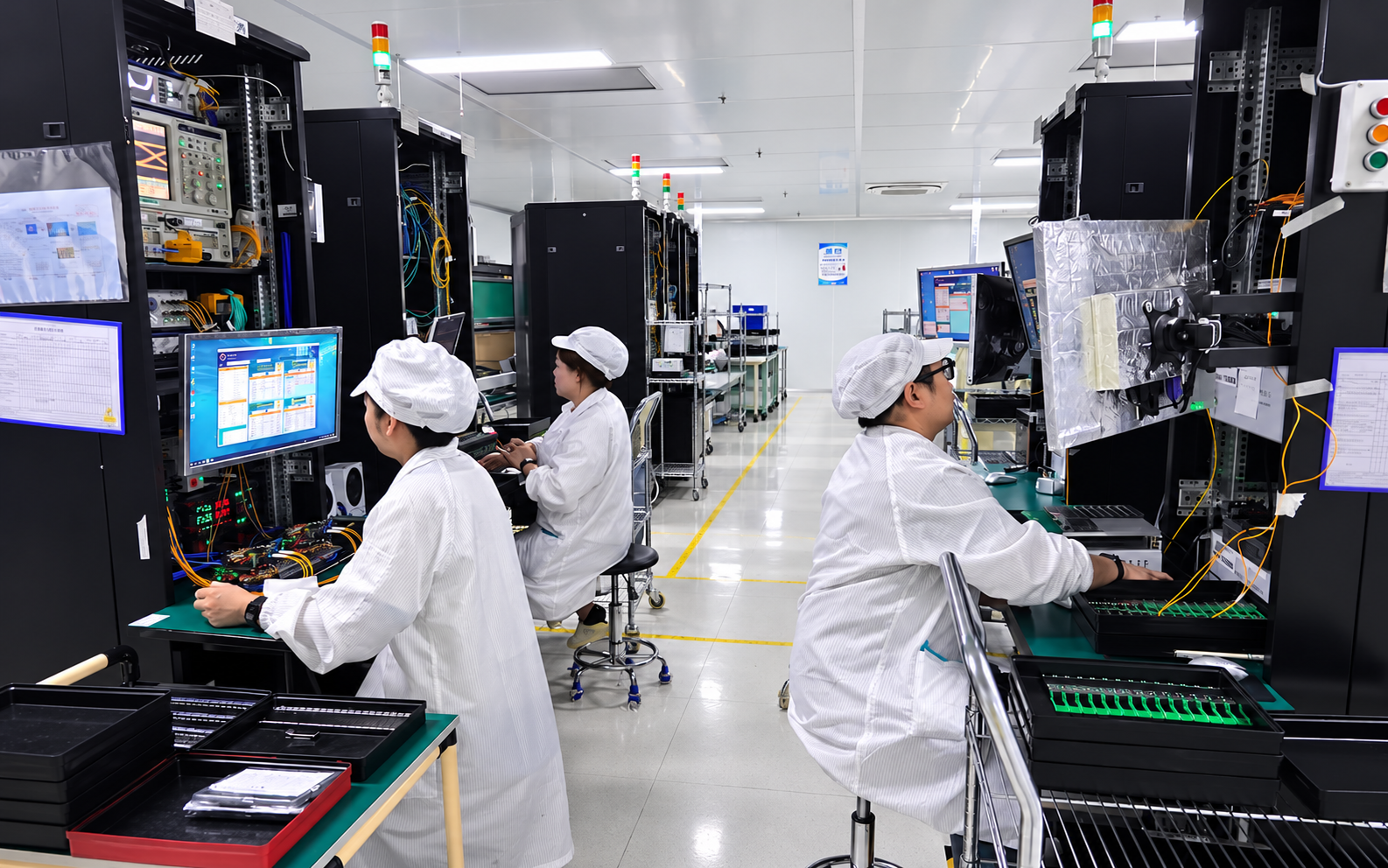 Hermesys engineers working at optical transceiver test racks